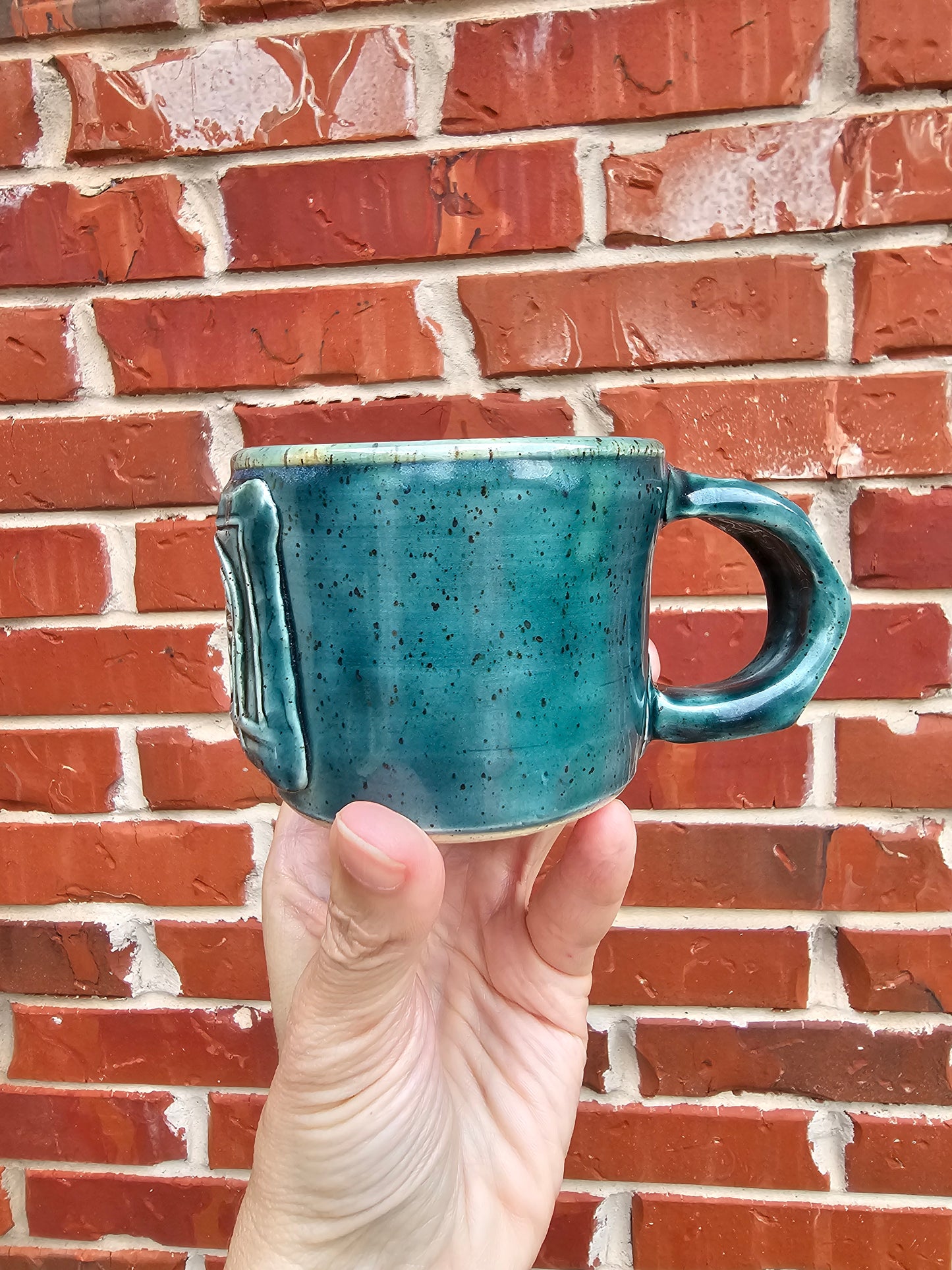 Rainforest Buddha Face Mug with Carved Handle